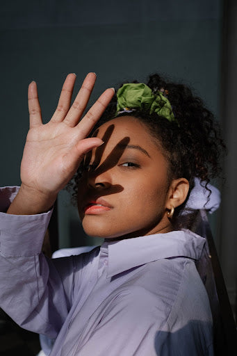 Two oversized pearl hair clips.